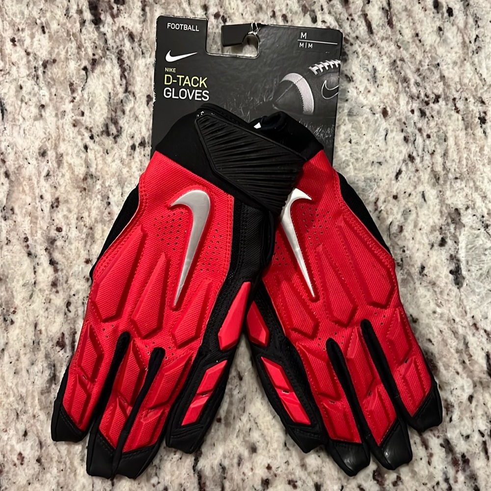 Brand new D tackle football gloves size Medium Nike